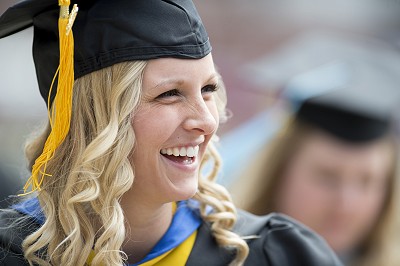 Student wearing graduation cap and gown