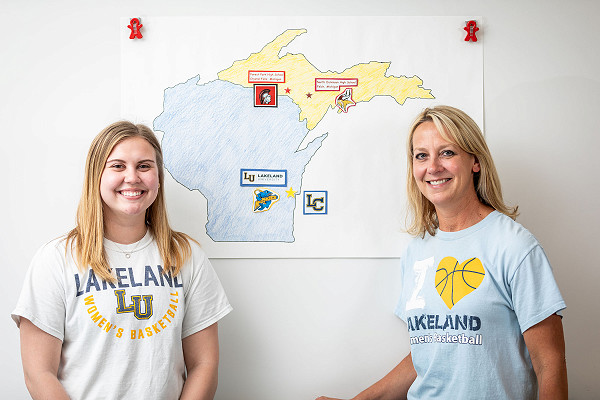 Lakeland Uniersity alum and student working together.