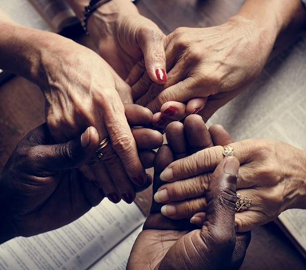 Hands of diverse religious shoot