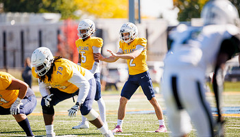2025 homecoming photo - football game action shot