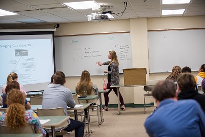 A Lakeland University student presents to their peers.